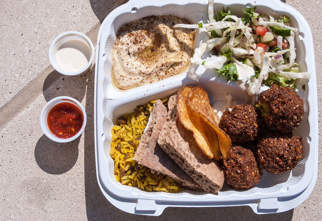 Falafel platter from Banzo Food Cart in Madison, Wisconsin with falafel, hummus, chopped salad, and pita triangle