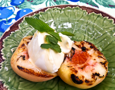 Grilled peaches topped with marscapone cheese and a drizzle of honey